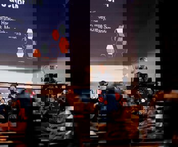 Panel on stage in the Society's Ondaatje Theatre.