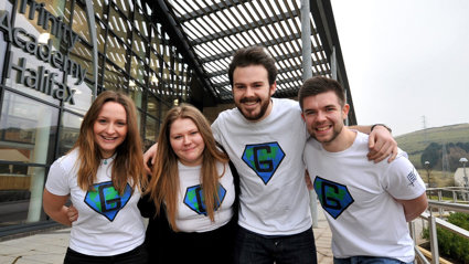 Group of people posing for a photo with their arms around each other's shoulders.