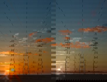 Electricity pylons stretching out into the distance