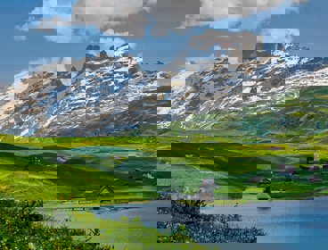 Mountains and green hills with houses